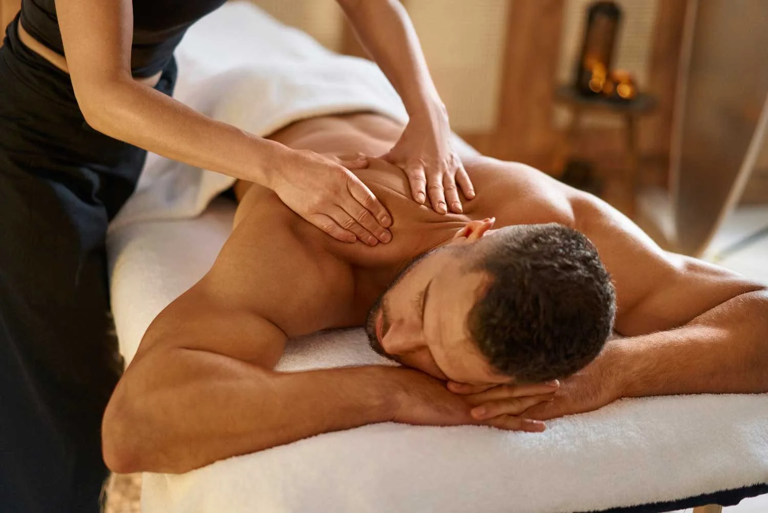 Serene woman receiving a tantra massage Budapest in pesti massage parlor